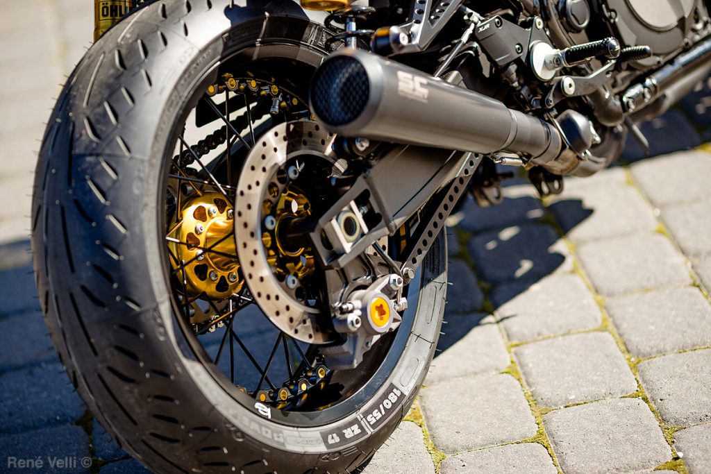 gold motorcycle spoked wheel hub